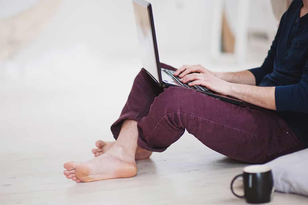 Working barefoot on laptop